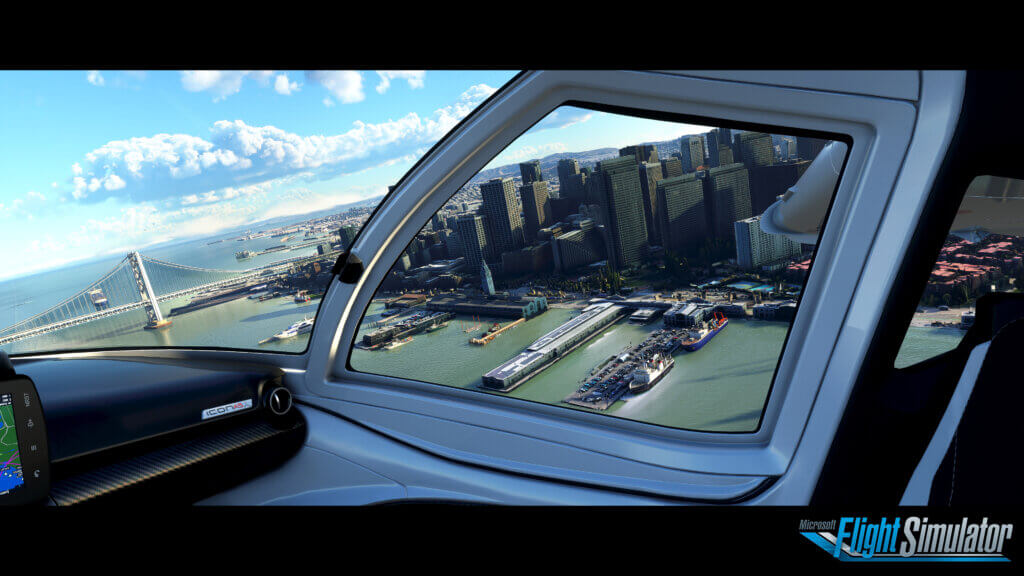 Plane window view over city