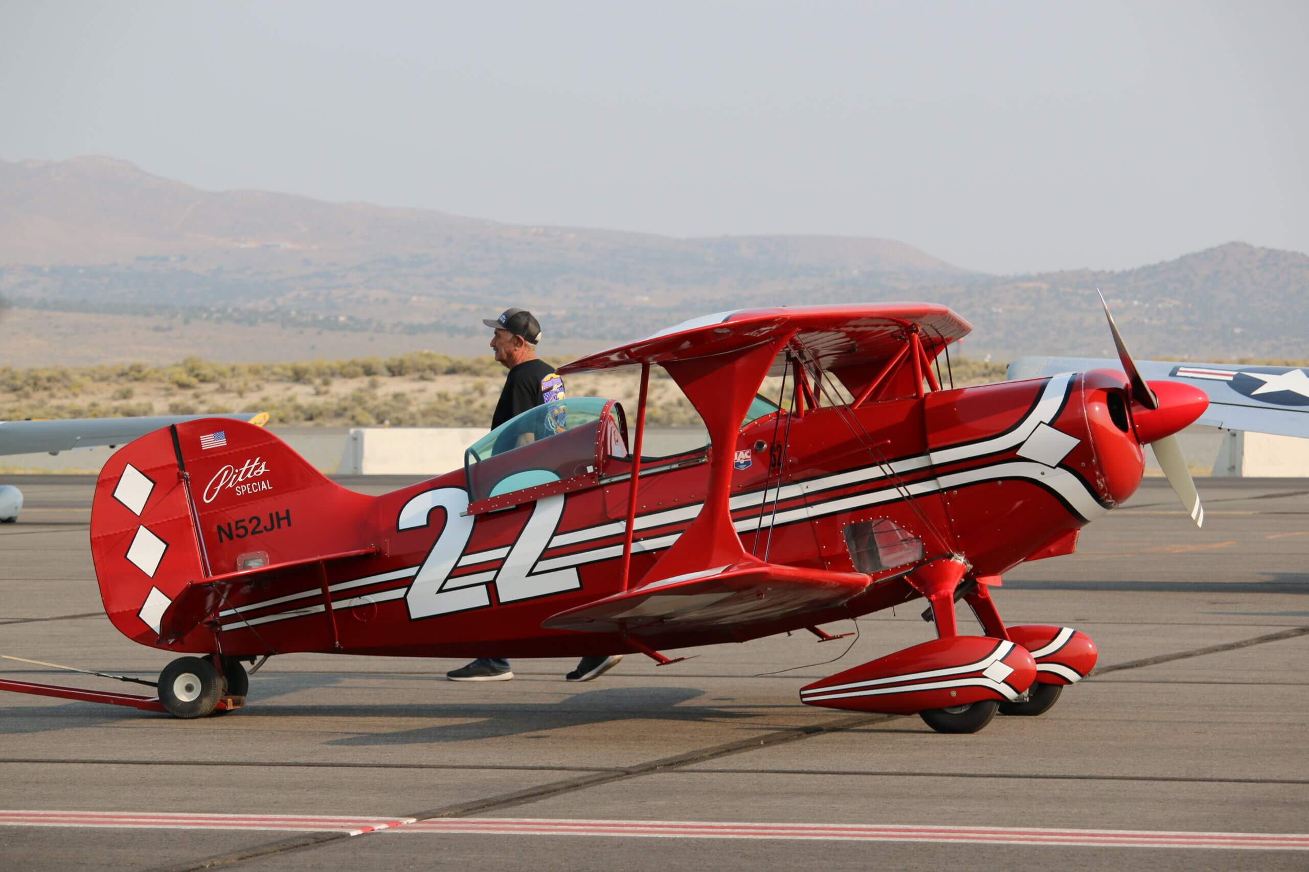 A red Pitts Special biplane