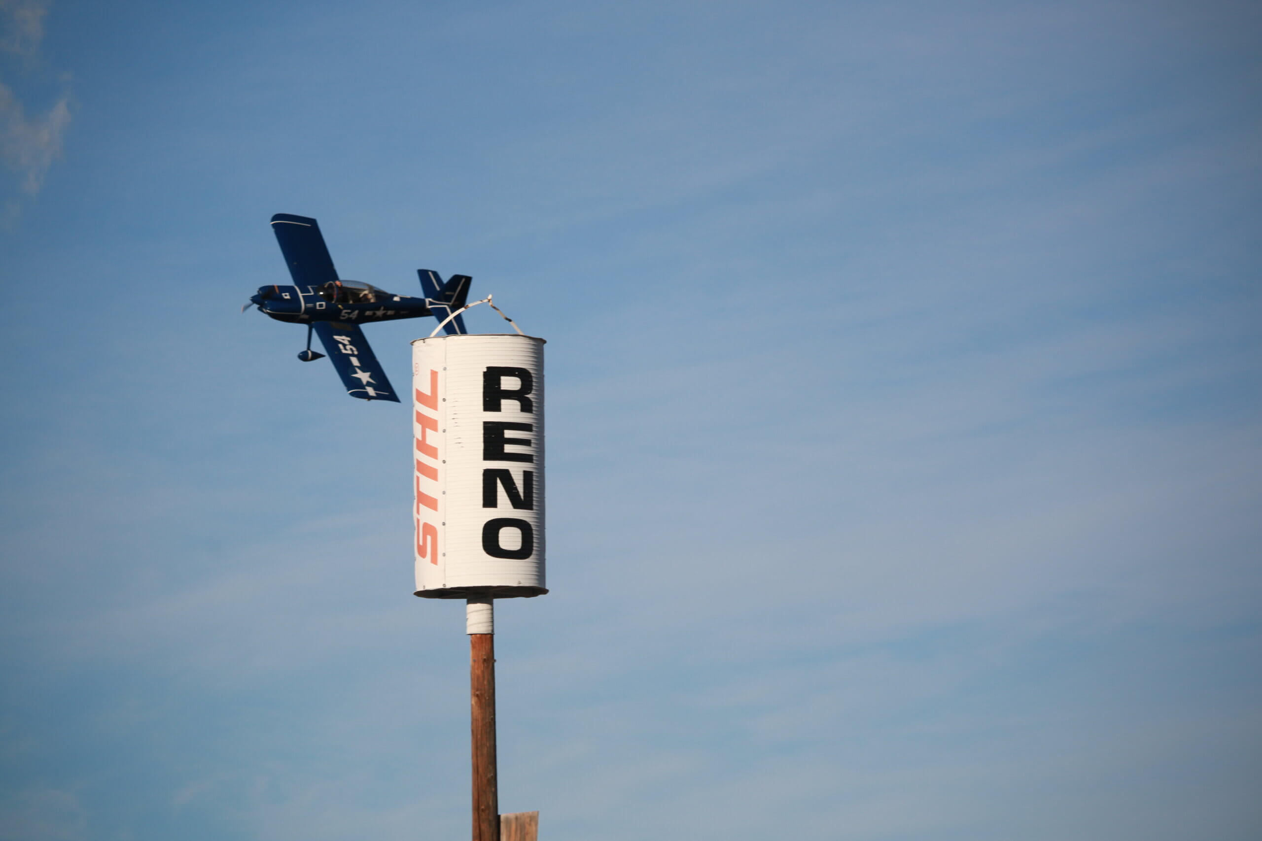 A Sport class plane flies past a Reno pylon