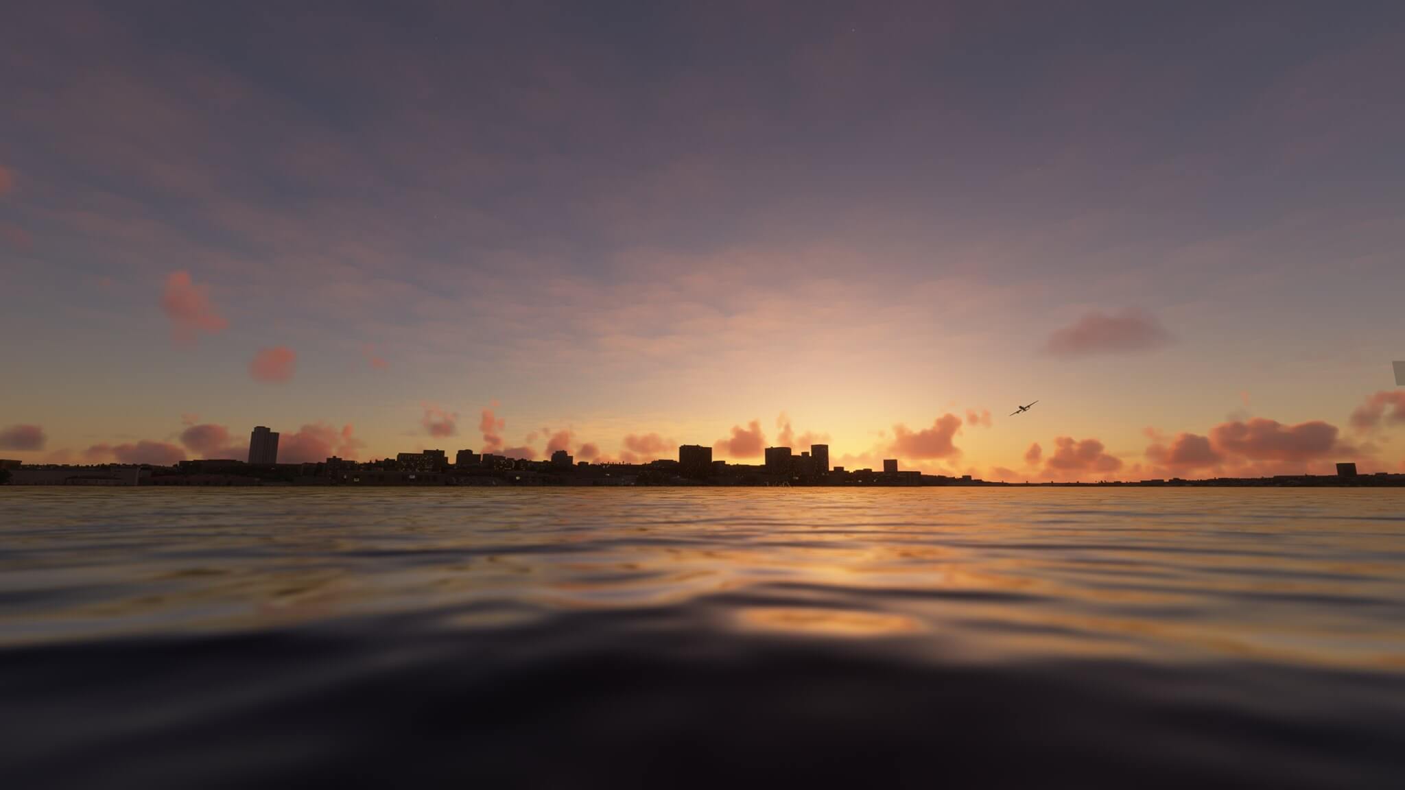 A plane flies over water near a city skyline