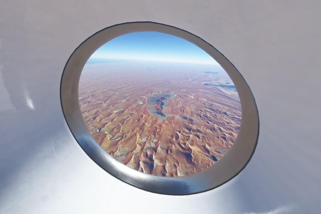 A view of the dessert out an airplane window