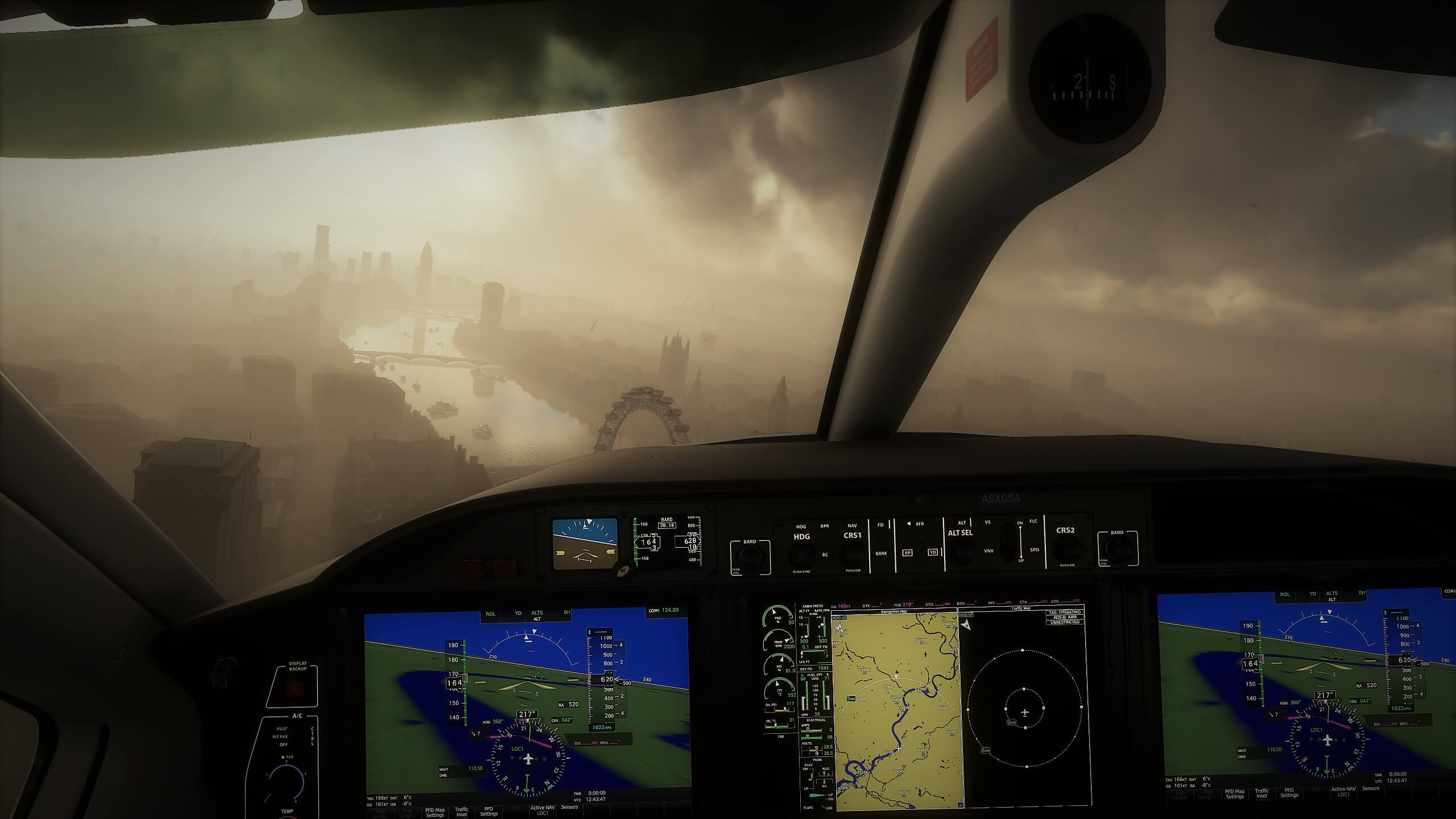 A foggy morning above London is visible through the window of a plane's cockpit.
