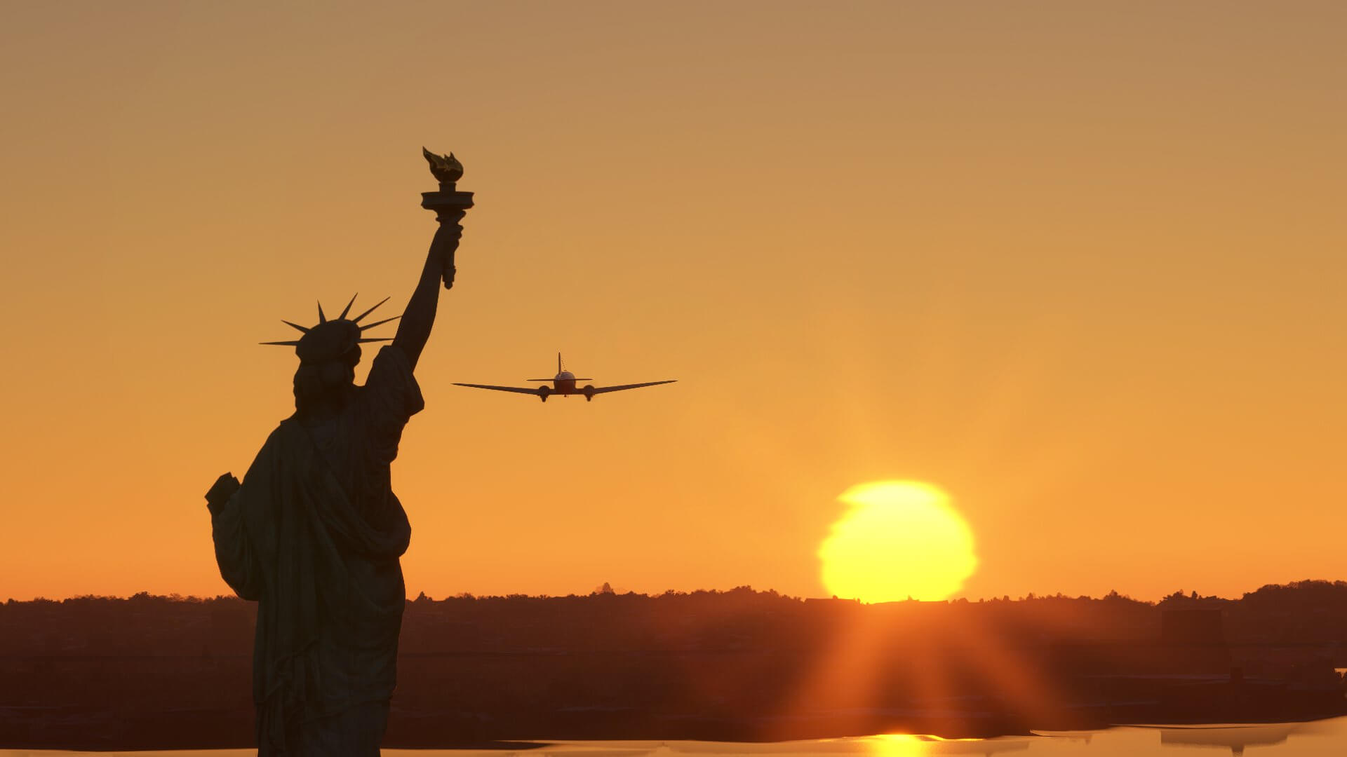 The sky is orange and a silhouette of a plane is visible beside the silhouette of the statue of Liberty.