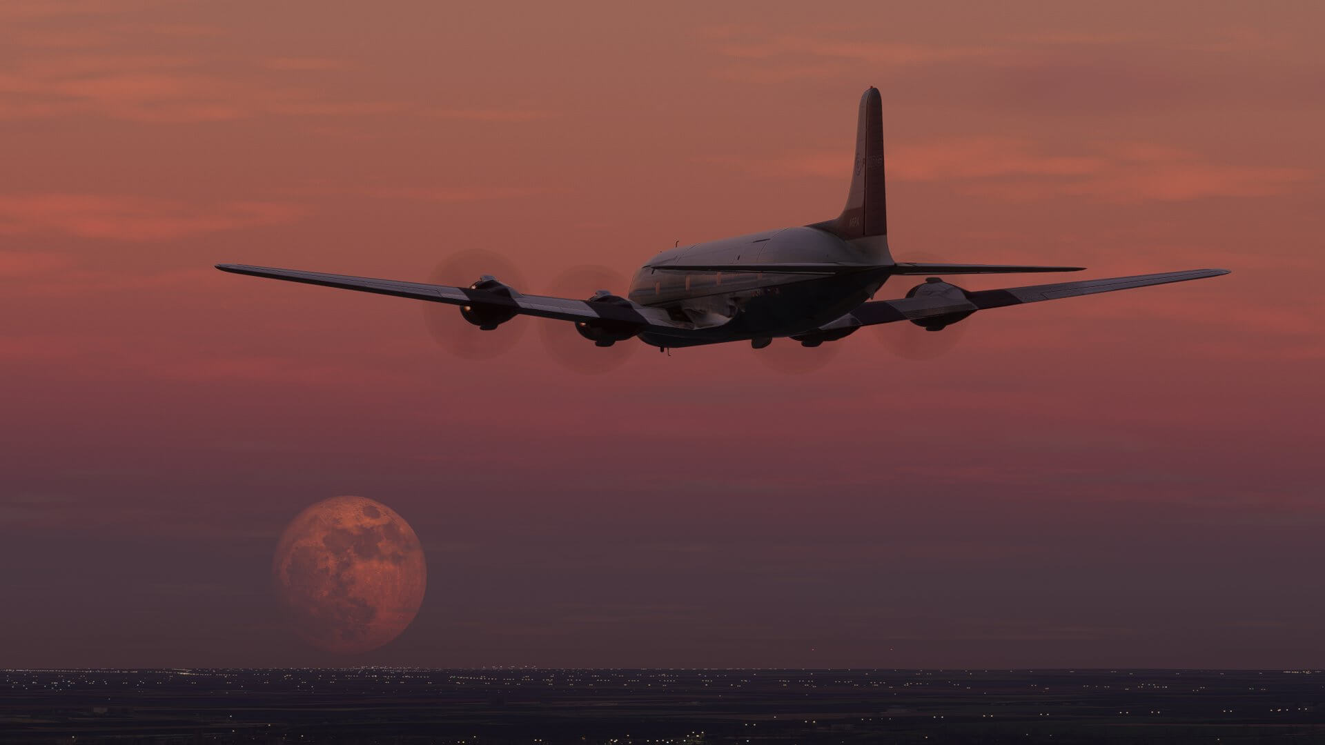 An airliner comes in for landing as the moon rises in the sky.