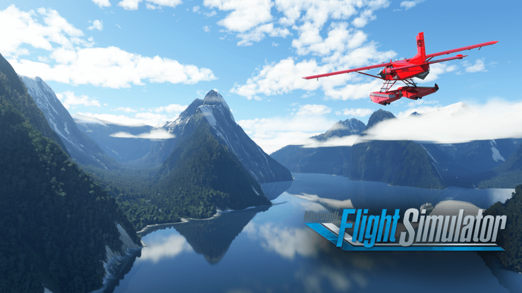 A red aircraft flies over a lake towards mountains.