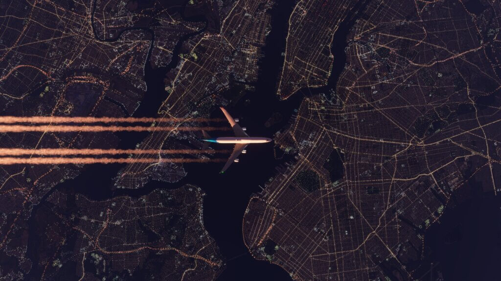 Top down view of a Boing 747 flying over New York City.