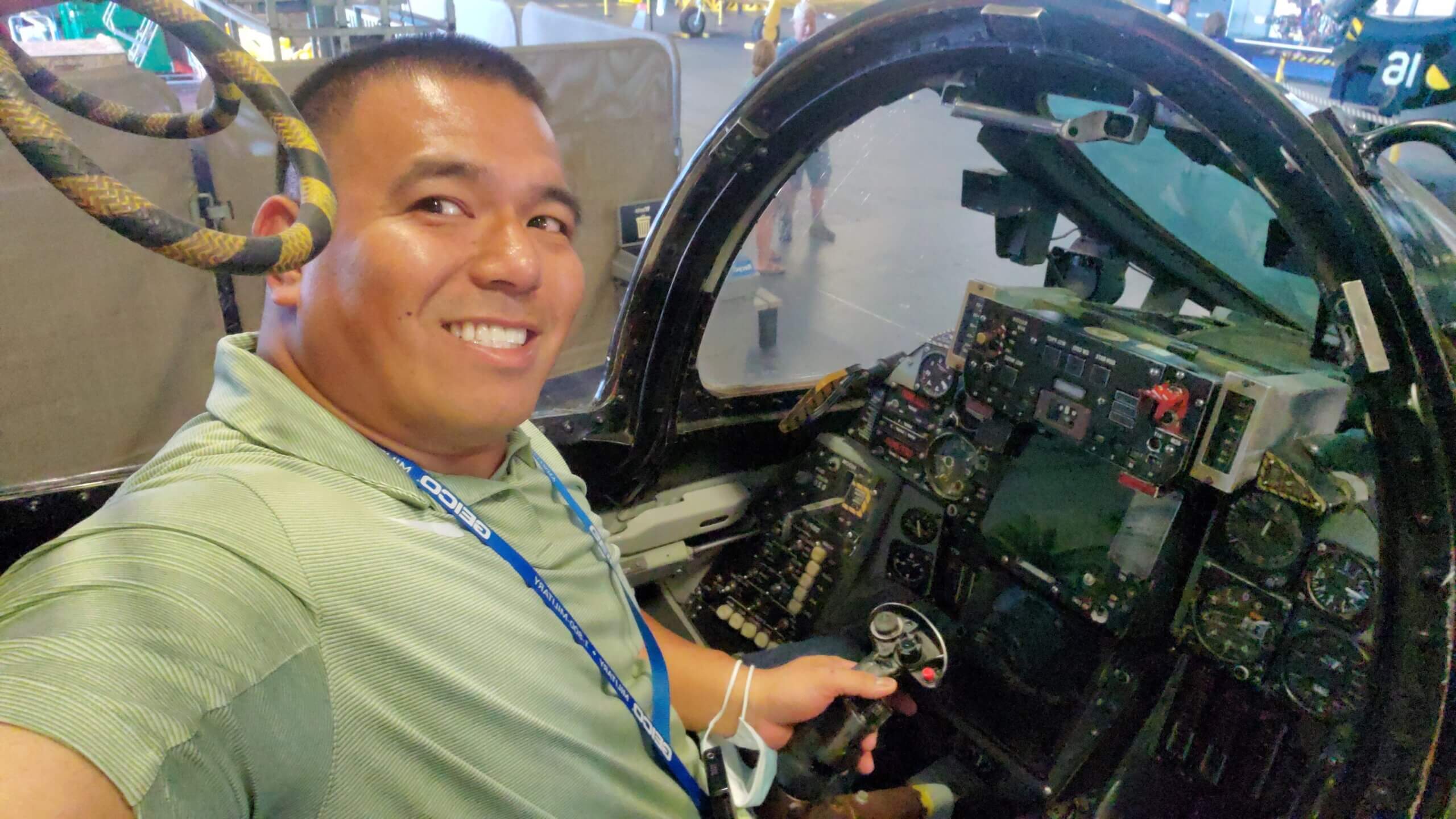JoeyBolo77 sits in the cockpit of an F-14 Tomcat at the USS Midway Museum in San Diego.