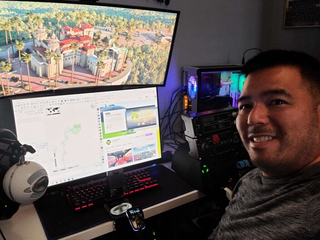 JoeyBolo77 seated at his PC where he plays Microsoft Flight Simulator and livestreams to Twitch