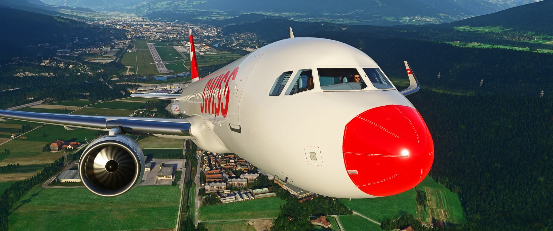 A head on view of a jetliner with a Swissair livery taking off from Innsbruck. The nose of the plane is painted red.