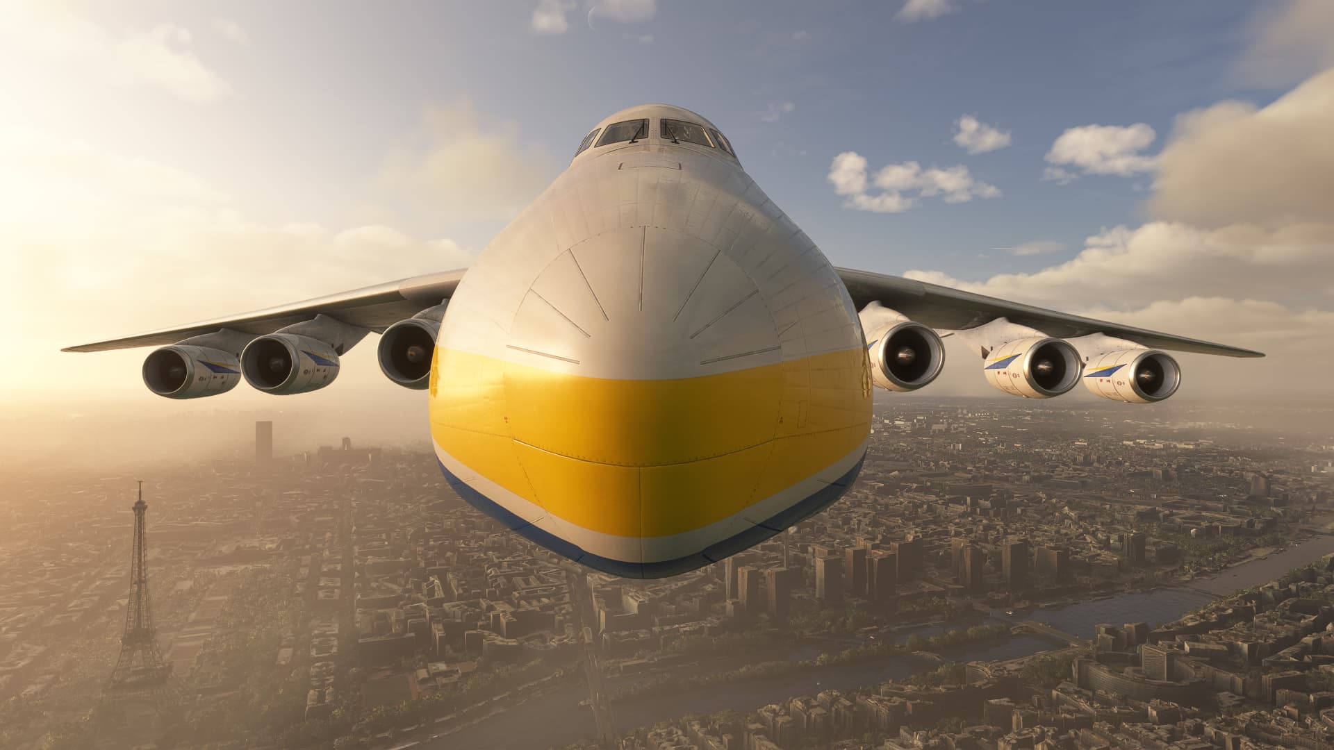 A head on view of the Antonov An-225 flying over Paris. The Eiffel Tower is visible in the bottom left of the image.
