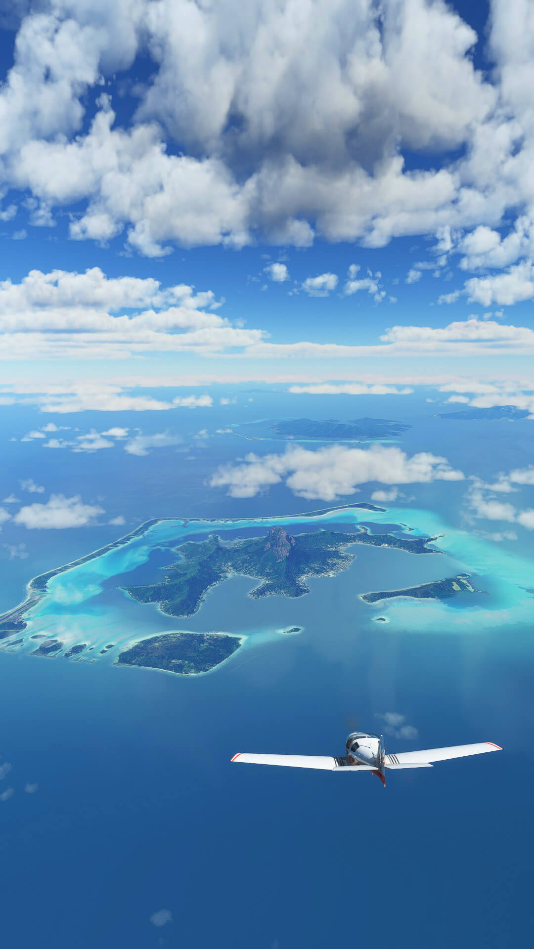 A small single engine prop plane flies toward Bora Bora in French Polynesia.