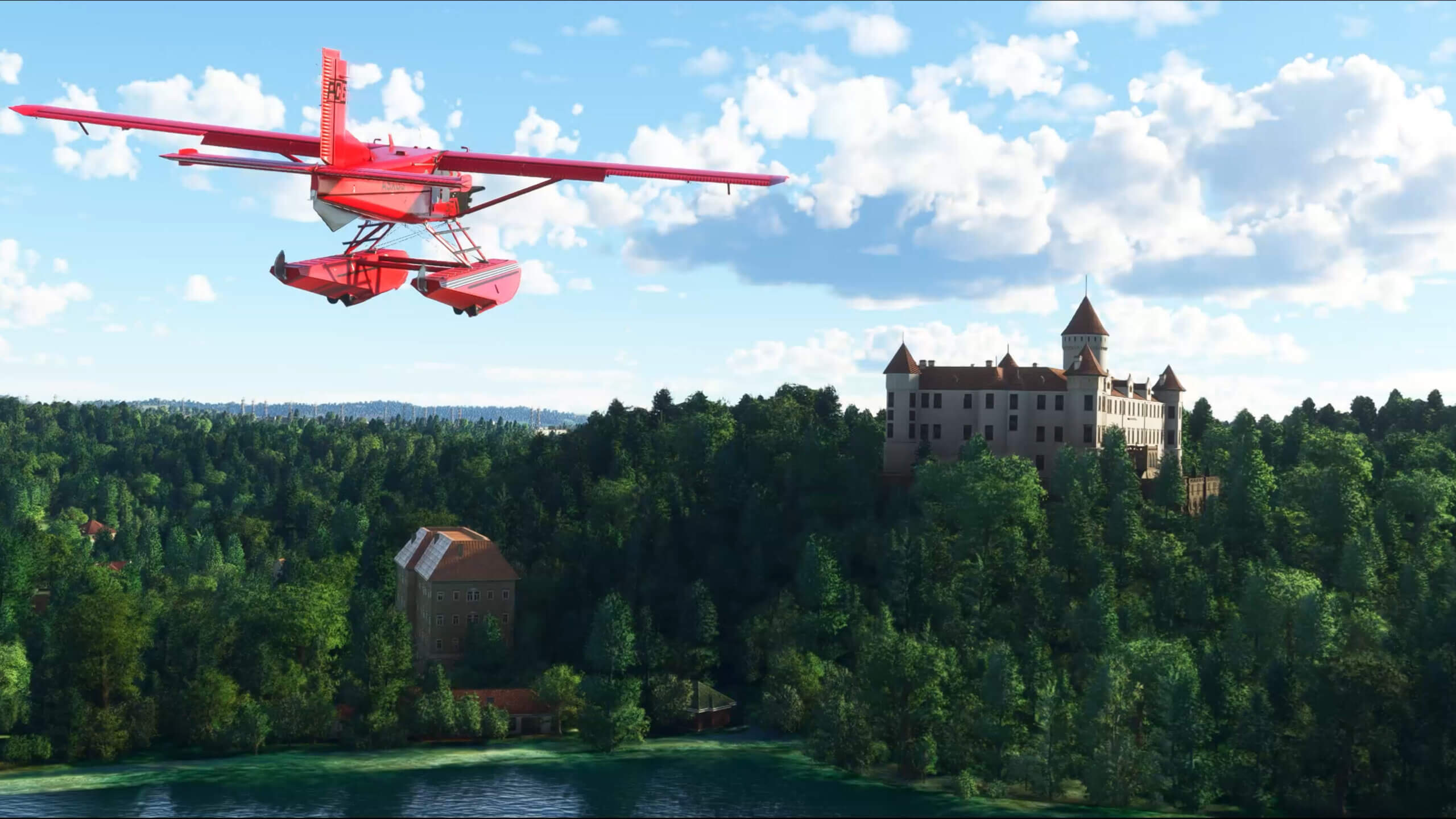 A prop plane with floats and a red livery flies over a castle in Eastern Central Europe