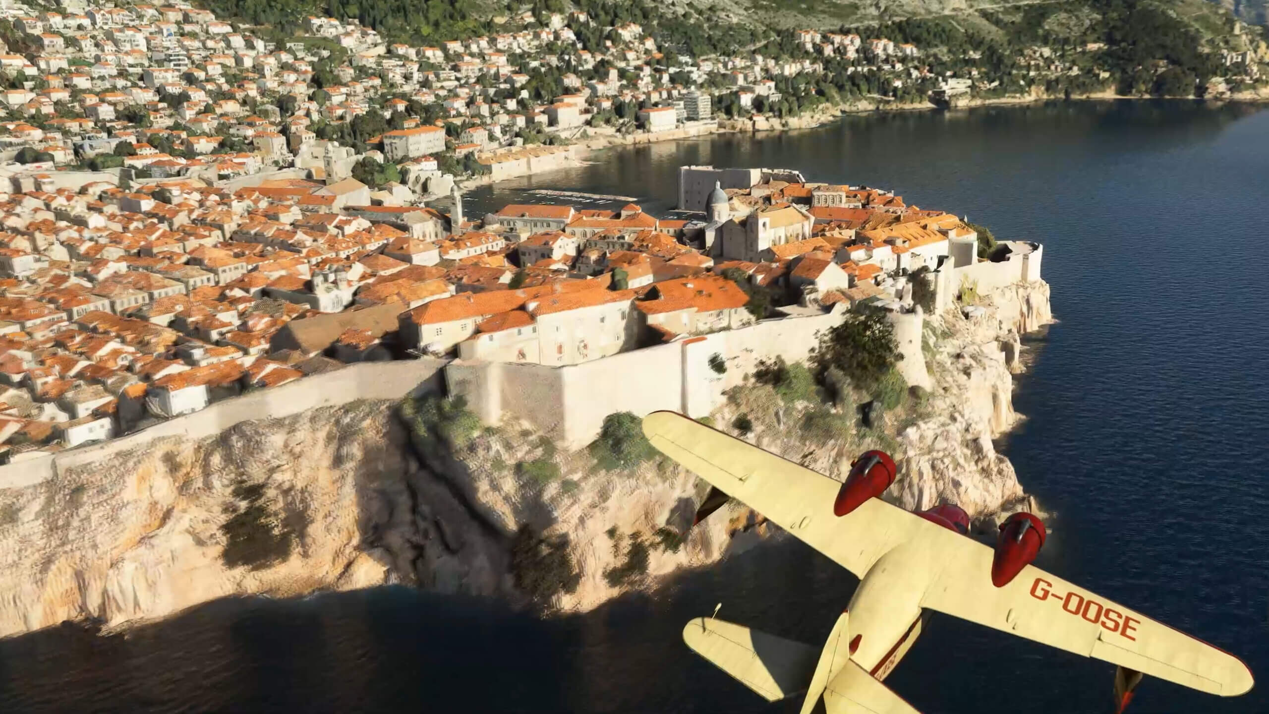 A Grumman Goose flies over the city of Dubrovnik