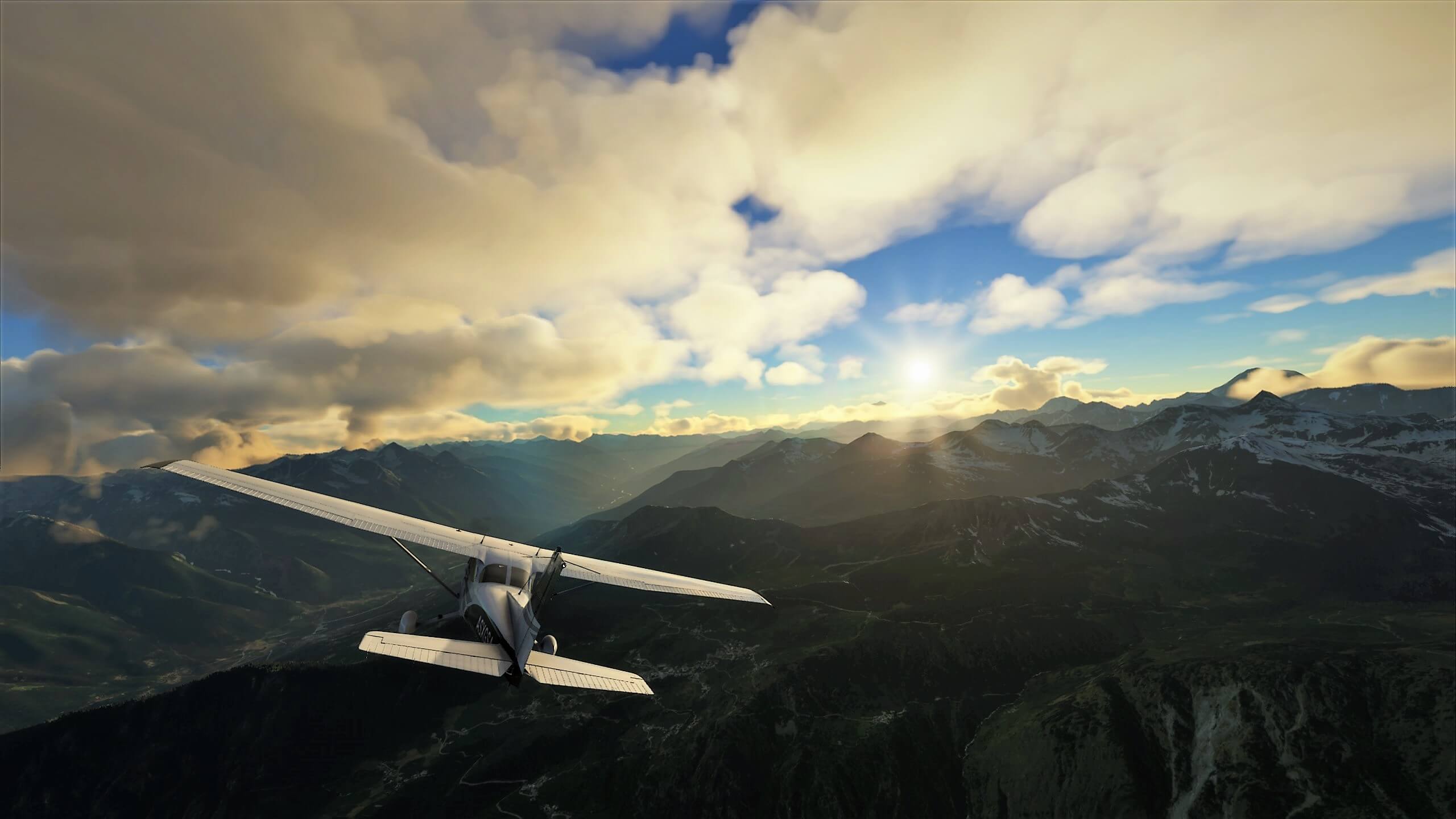 A Highwing Cessna 172 banks right over high terrain, with snow on the mountain peaks. Scattered clouds high above keep visibility clear and the sun can be seen shining brightly up ahead.