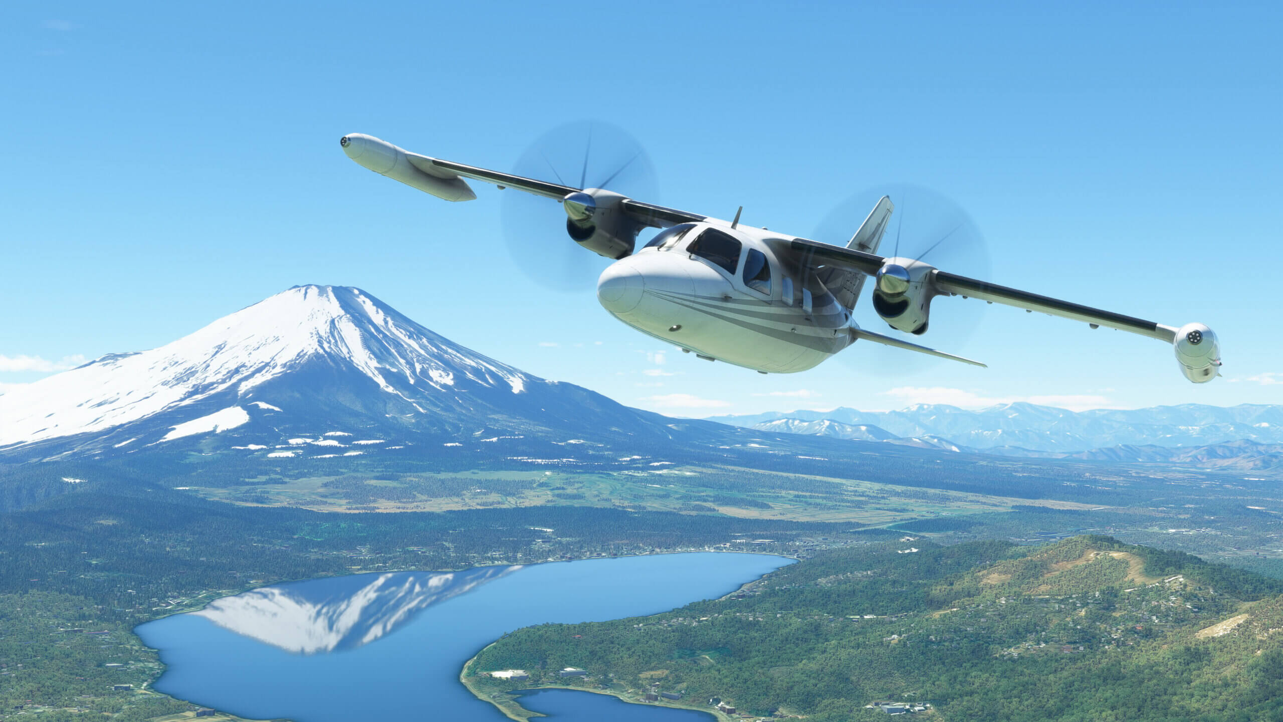 A Mitsubishi Heavy Industries MU-2 flies with Mount Fuji in the background.