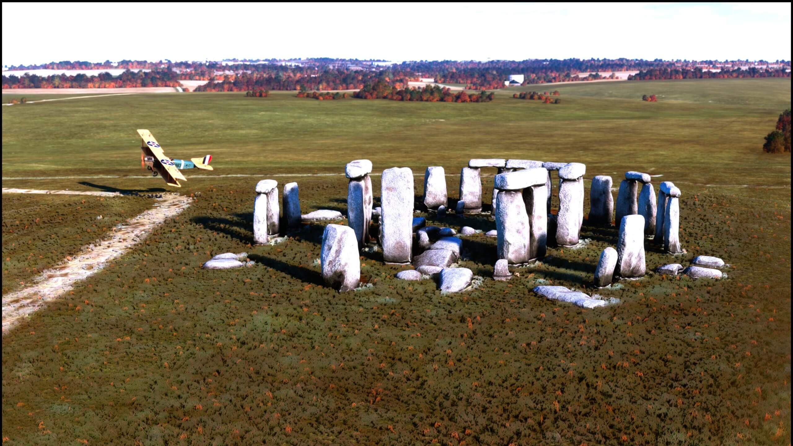 A bi-plane takes a close up view of Stonehenge, with a low flyby of the historic monument.