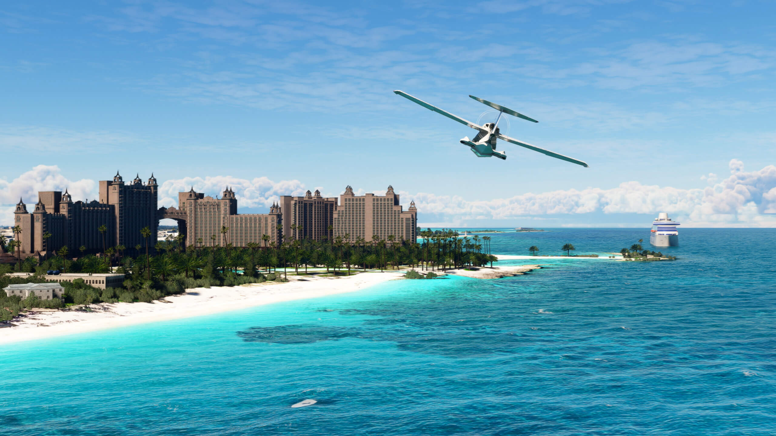 An ICON A5 flies over the Atlantis resort in the Bahamas