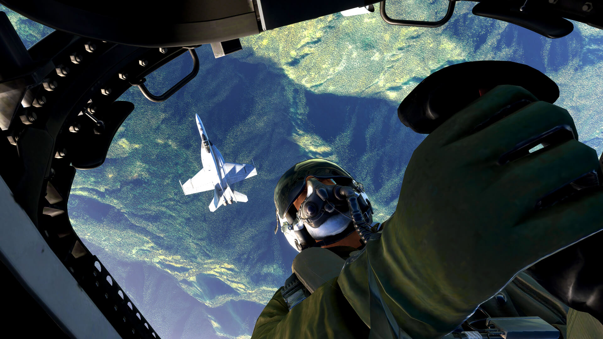 An F/A-18 Hornet pilot flies inverted above another Hornet whilst looking out of the glass canopy.