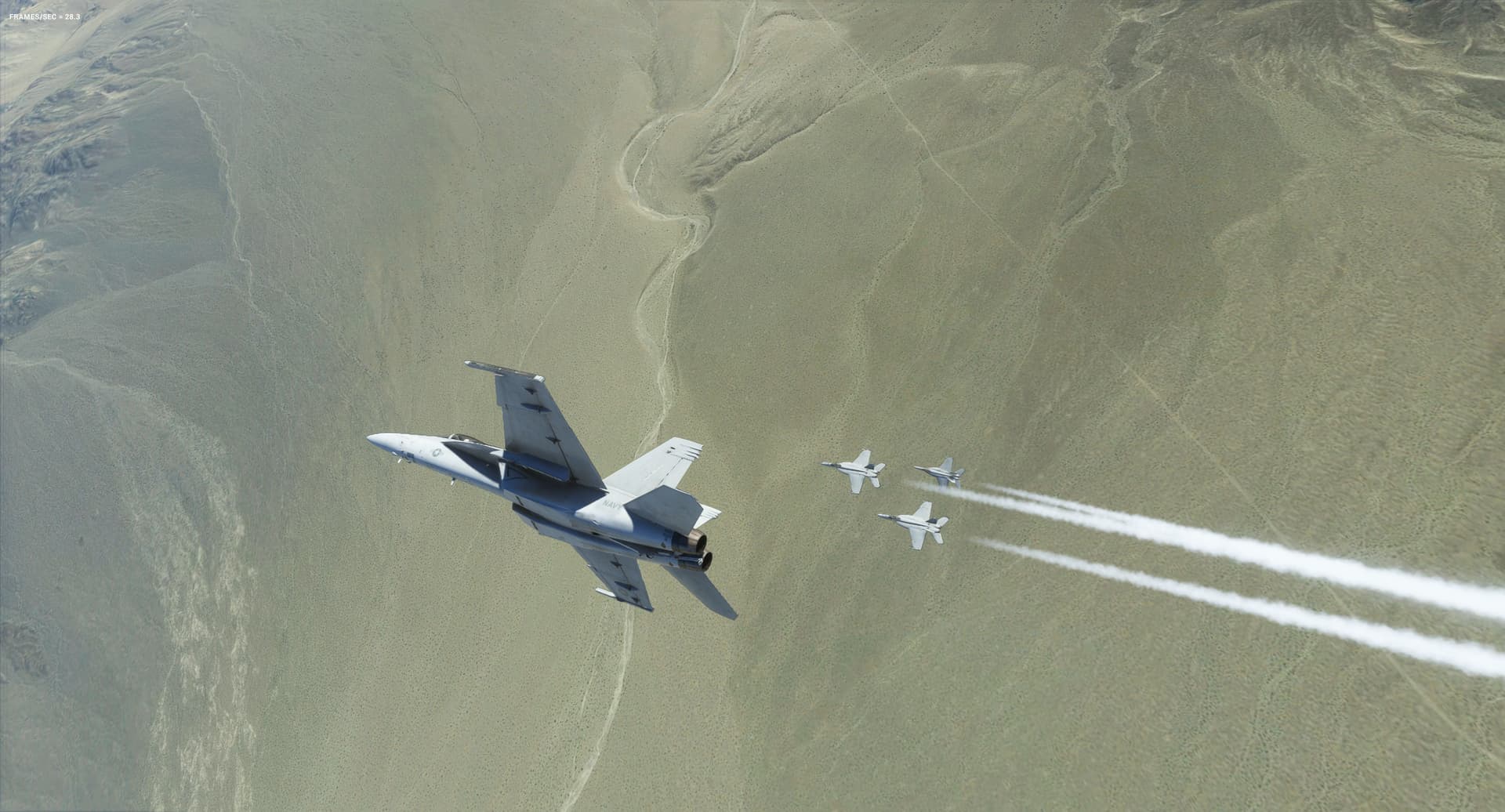 An F/A-18 Hornet flies inverted over the top of three other Hornets in close formation with one another.
