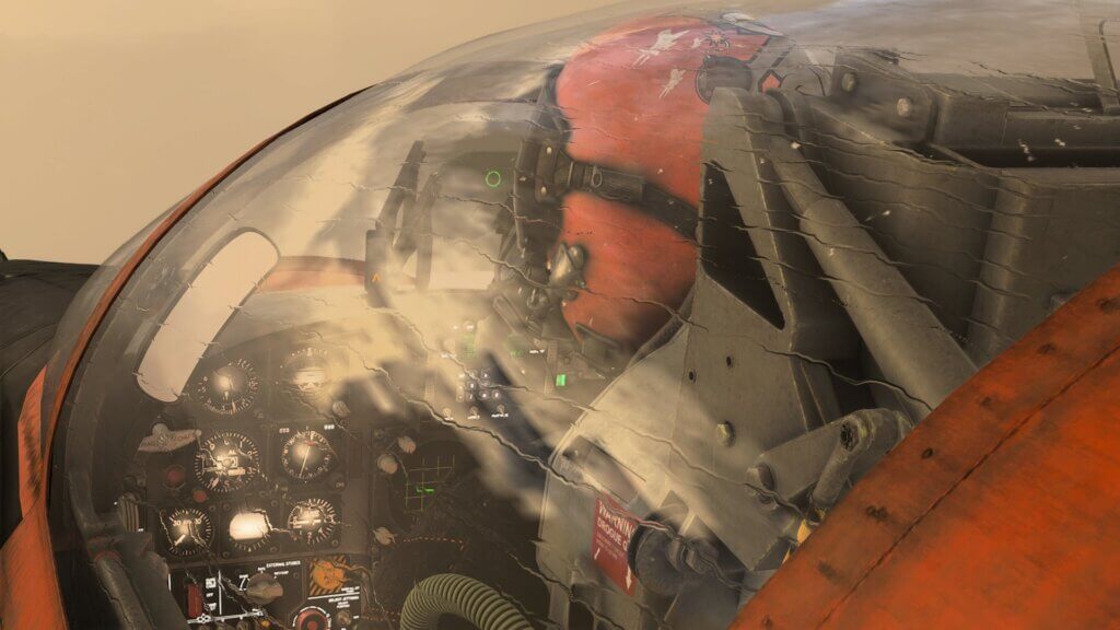 A military pilot with red helmet looks out of the cockpit window of their F-5, with rain drifting across the canopy.