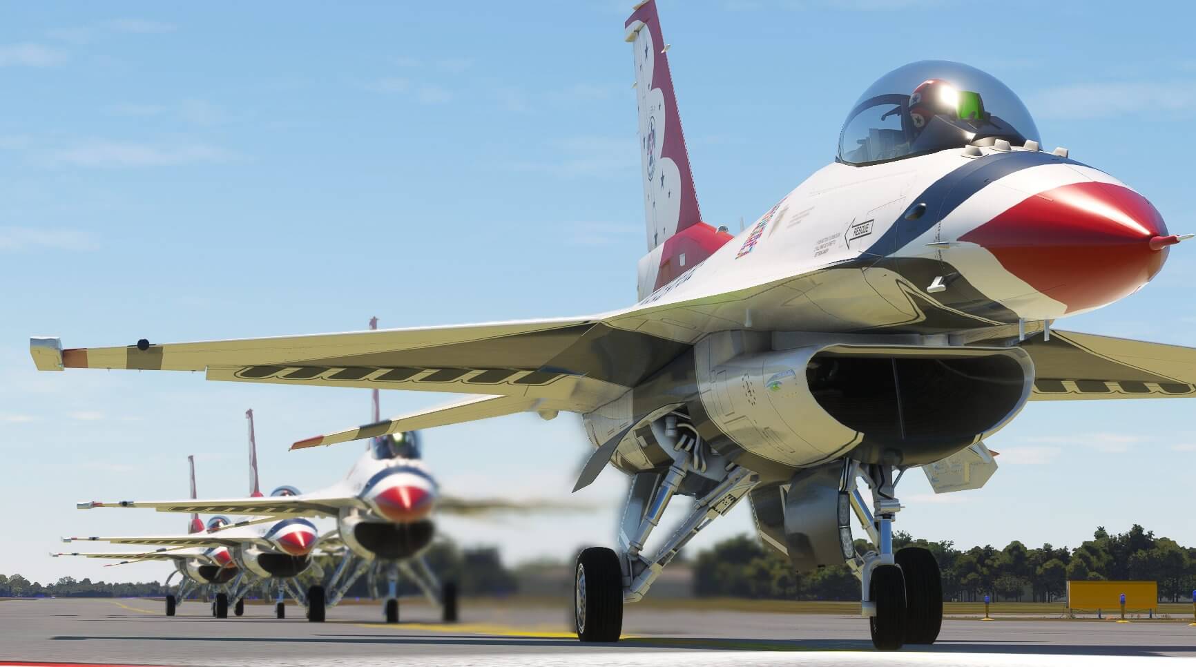 4 F-16 Vipers from the Thunderbirds taxi out for departure in line astern.