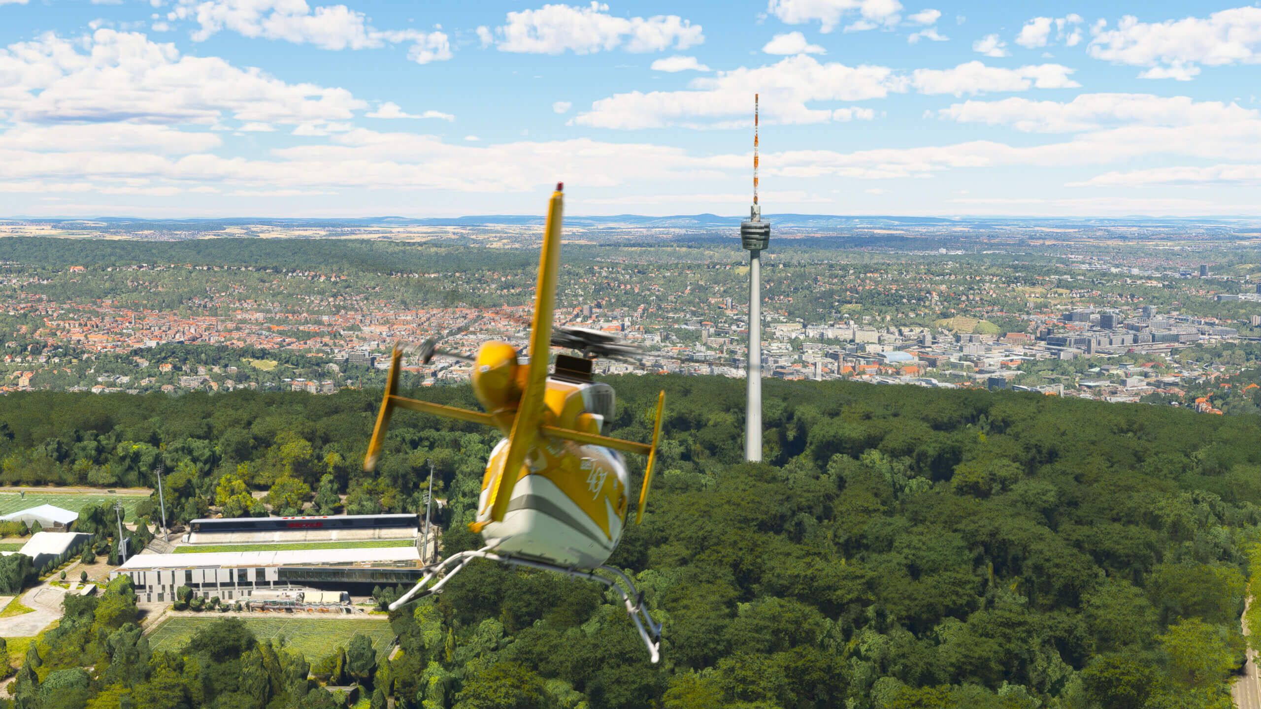 A helicopter flies towards a communications tower in Germany.