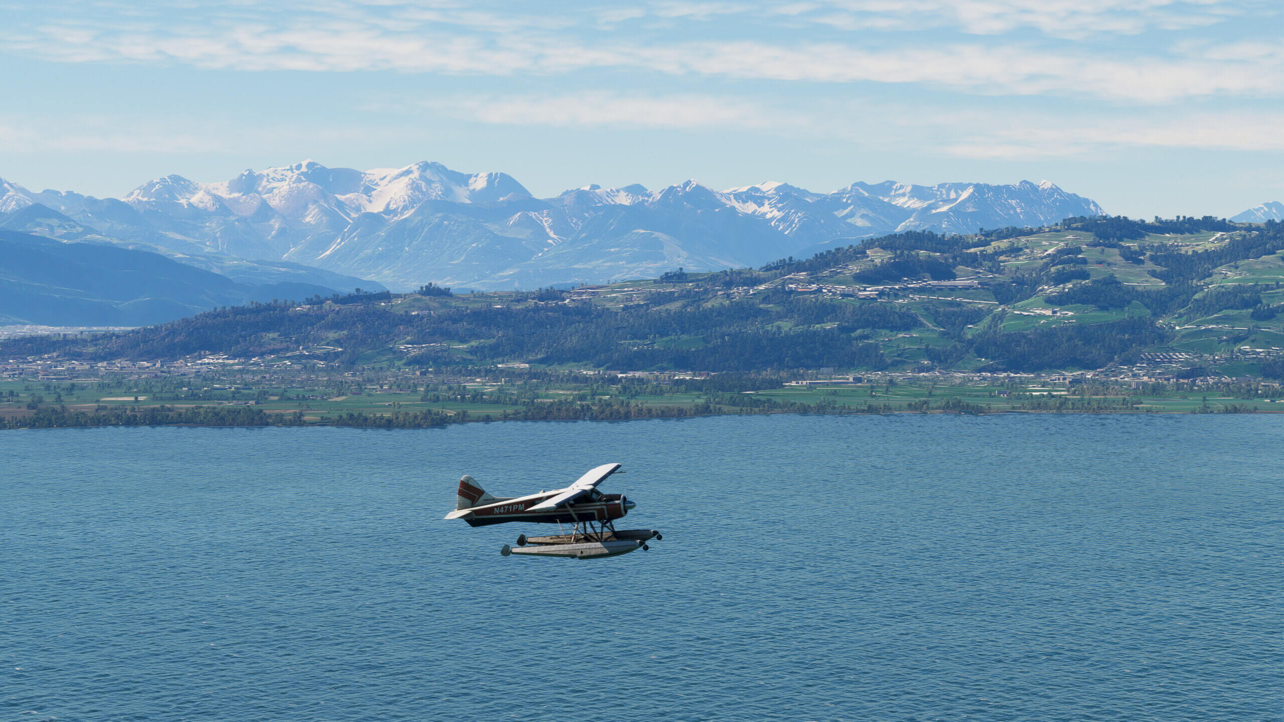 A de Havilland DHC-2 Beaver flies on floats over a lake in Germany.