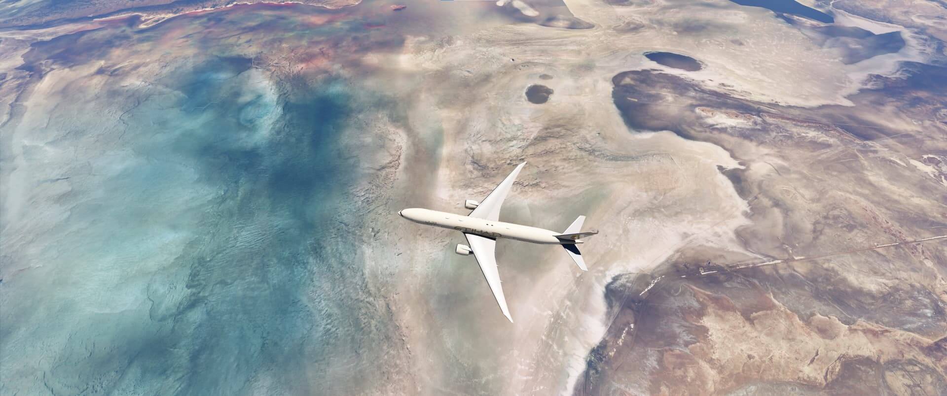 An Etihad Boeing 777 cruises high above a desert