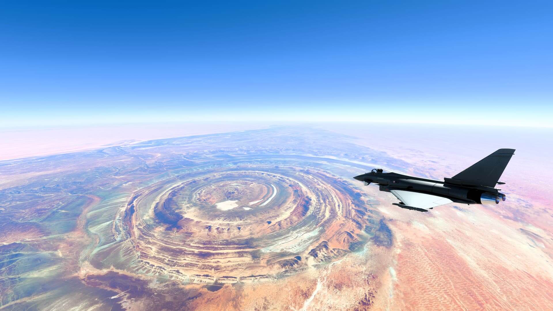 A Eurofighter Typhoon cruises in clear skies above a vast desert