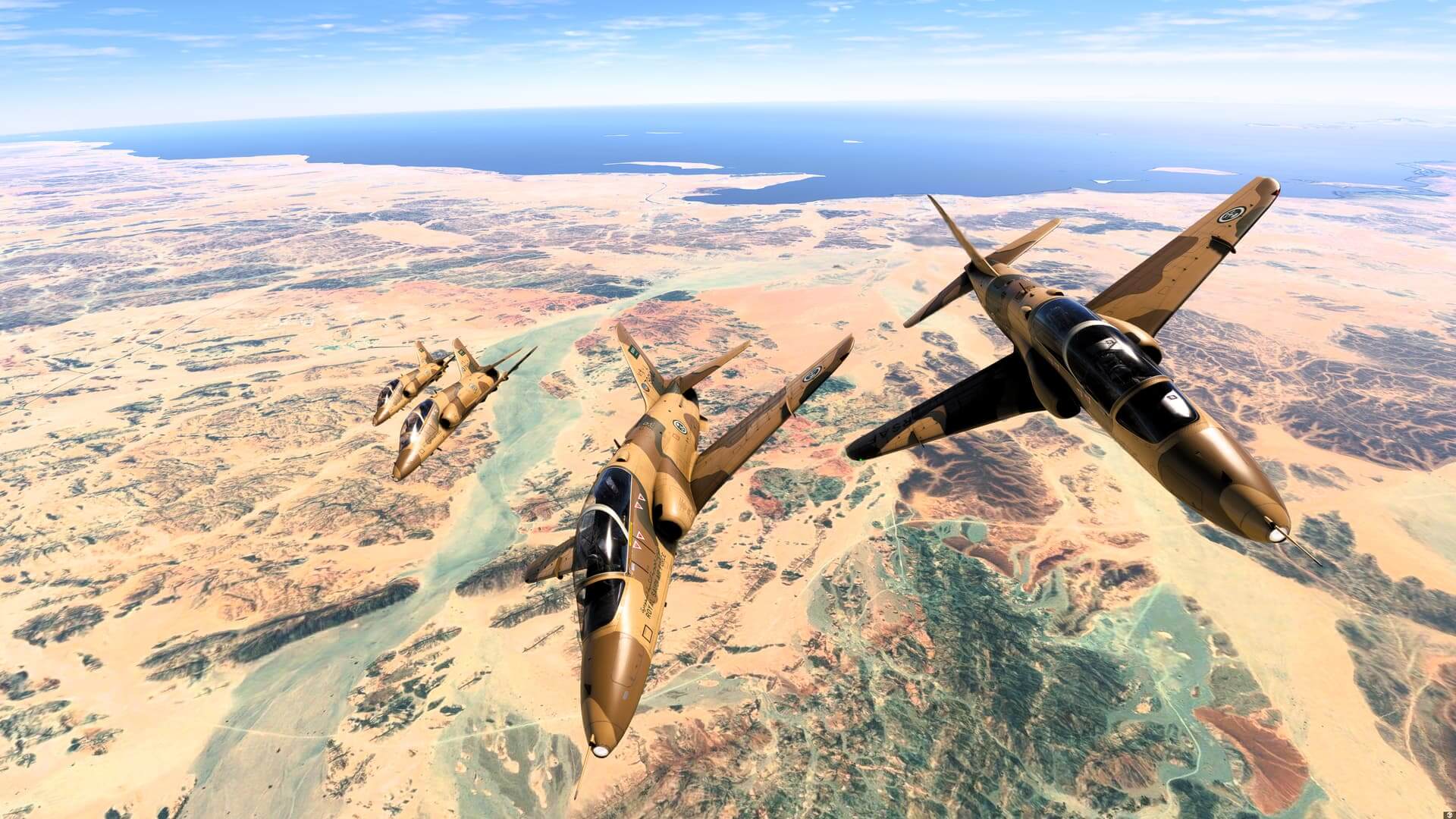 Four BAe Hawk aircraft in desert military paint cruise bank right in close formation above sandy terrain below