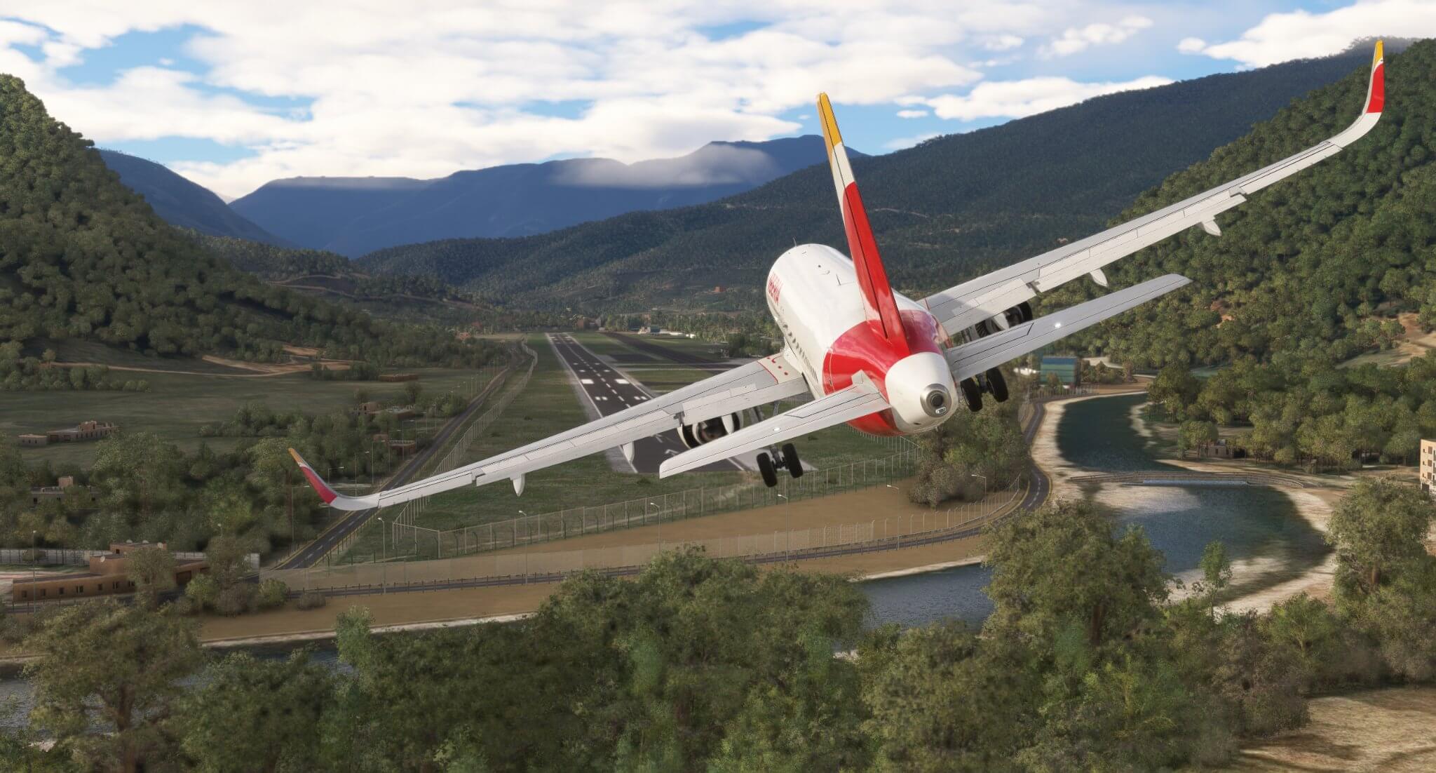An Iberia Airbus A320 NEO banks left to line up with a short runway located in a valley.