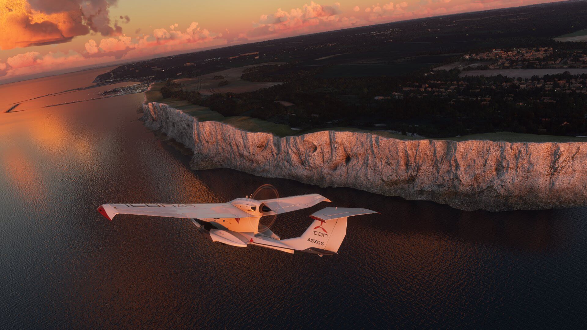 The Icon A5 banks right whilst flying next to the white cliffs of Dover, England