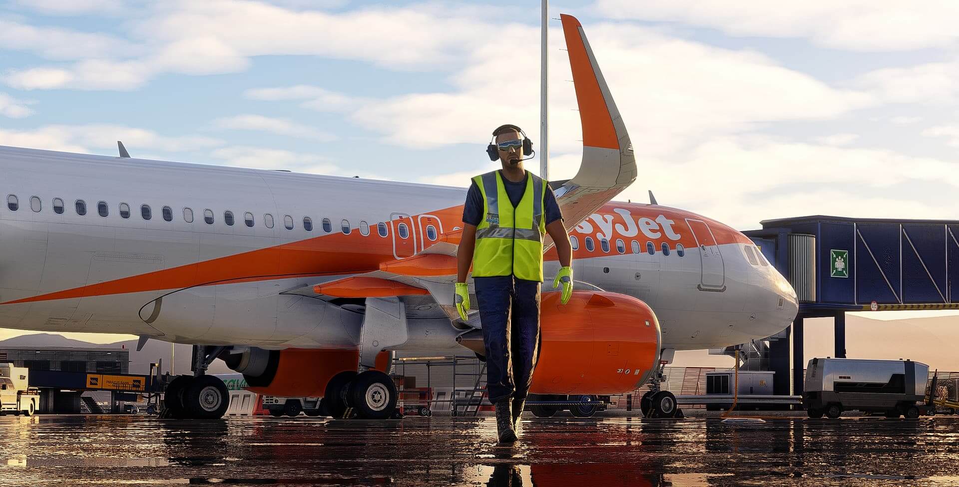 A ground crew member in high visibility jacket and noise cancelling headphones walks away from an Airbus A320 NEO in EasyJet paint, parked on the airport ramp.