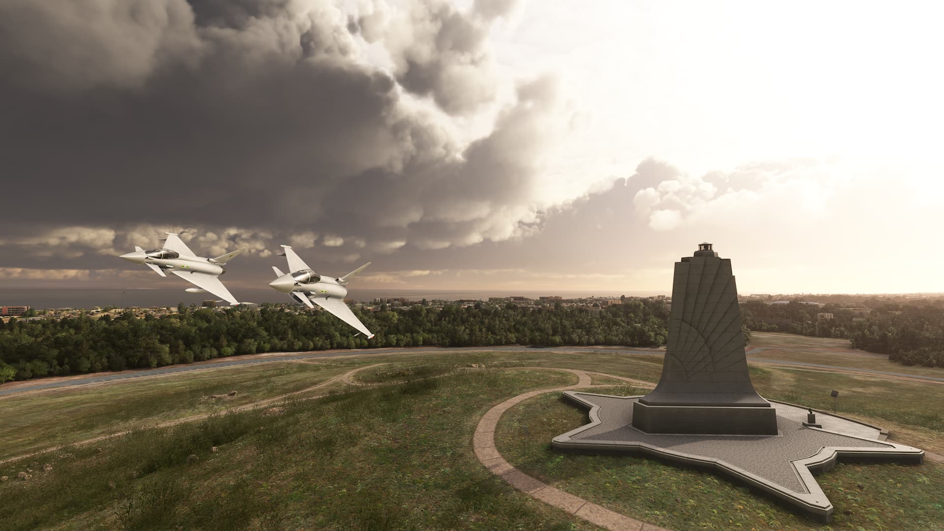 Two Eurofighter Typhoons in close formation fly past the Wright Brothers Monument