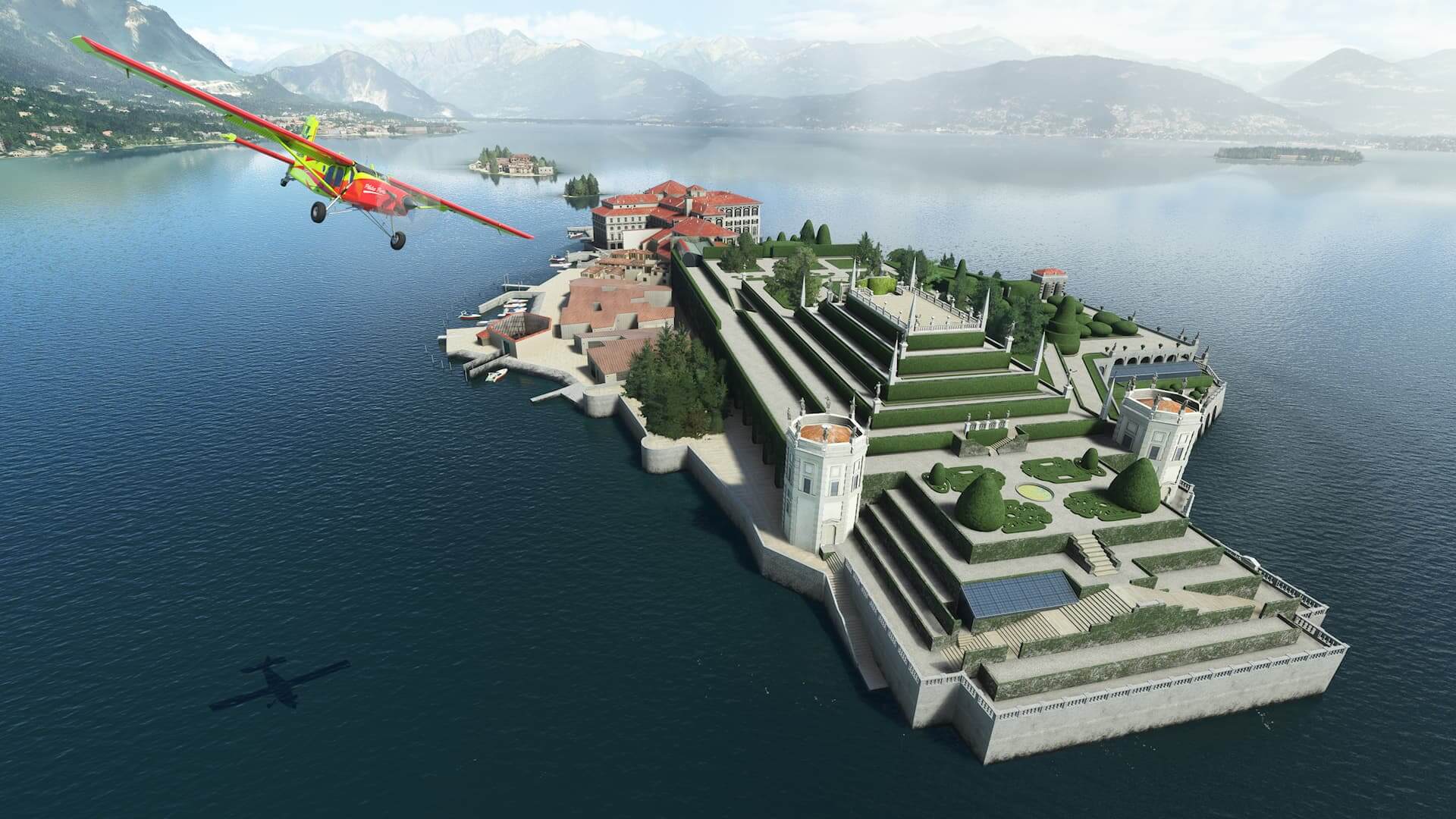 A red and yellow high wing propeller aircraft passes over palace gardens on an island