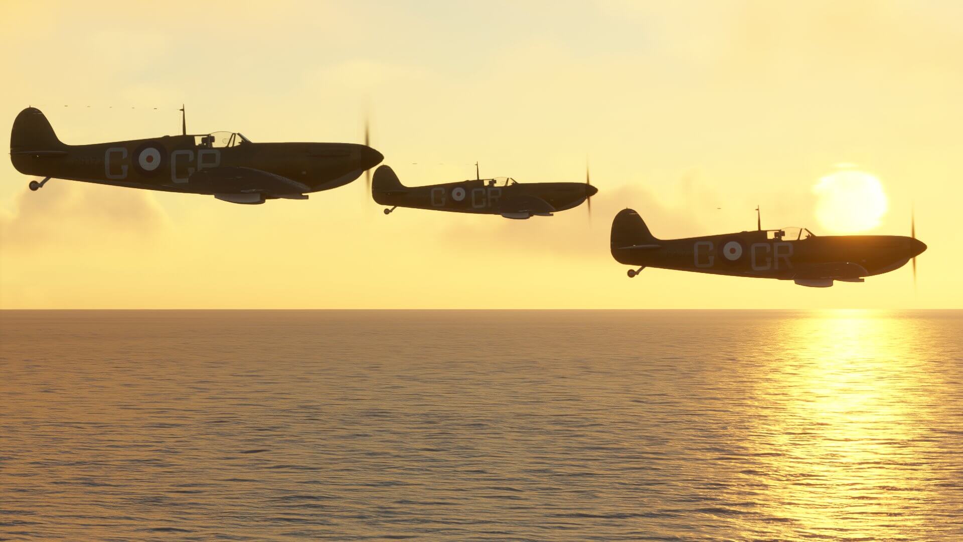 Three Spitfire warbirds fly in close formation low to the water surface, with the sun setting in the distance.