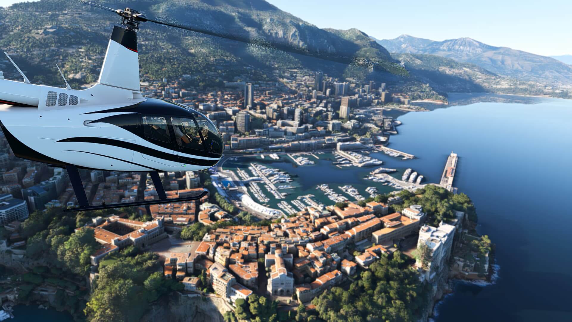 A Robinson R66 heads towards the harbour in Monaco