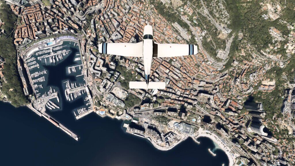 A low wing propeller aircraft from a birds eye view above Monaco