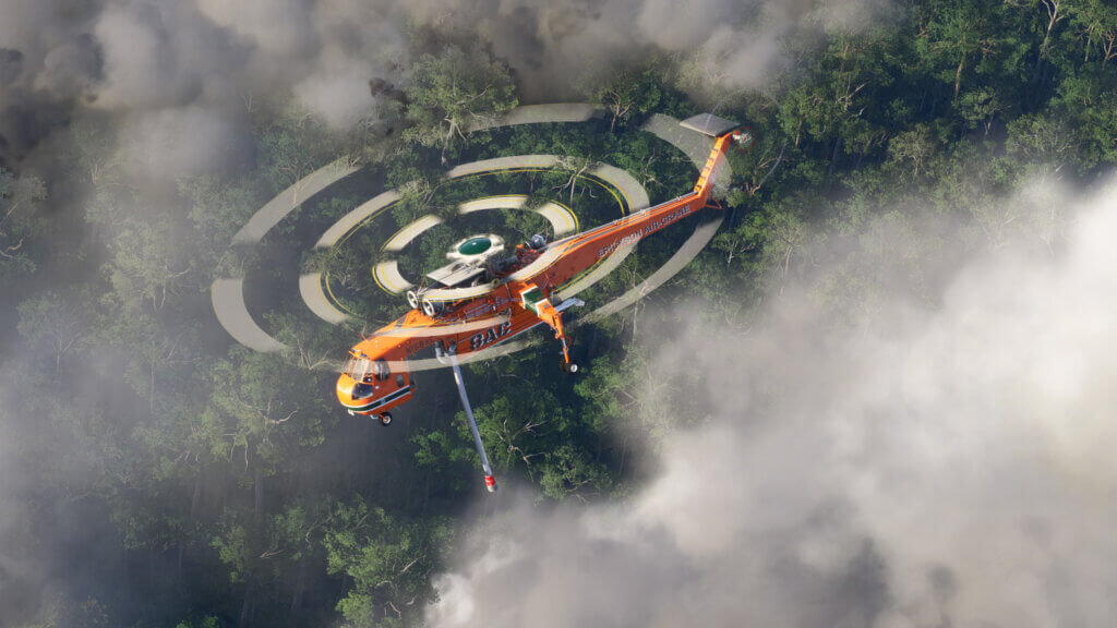 An orange painted S-64F Skycrane hovers over a dense forest shrouded in smoke
