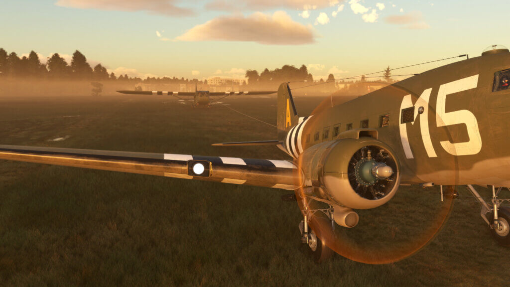 Douglas C-47D Skytrain pulling the Waco CG-4A glider during sunrise