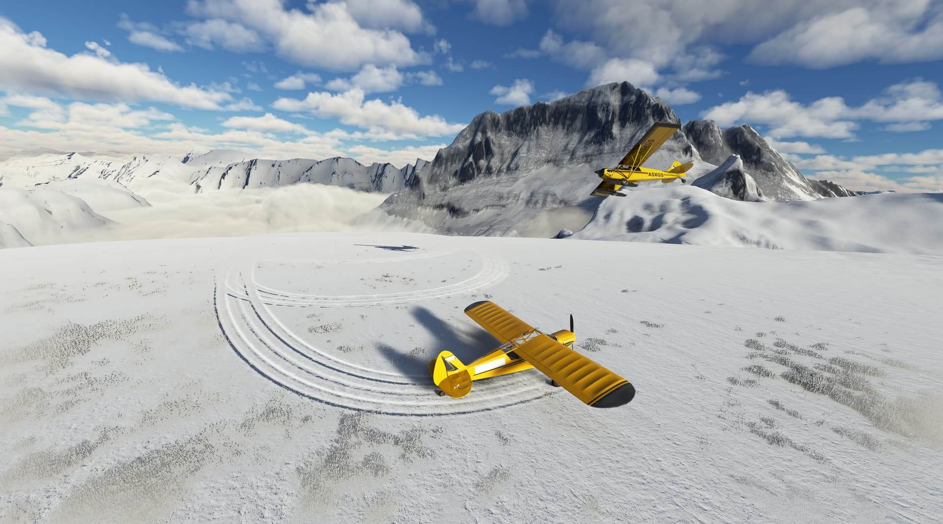 Two yellow X-Cubs enjoy some bushcraft flying across snow covered terrain