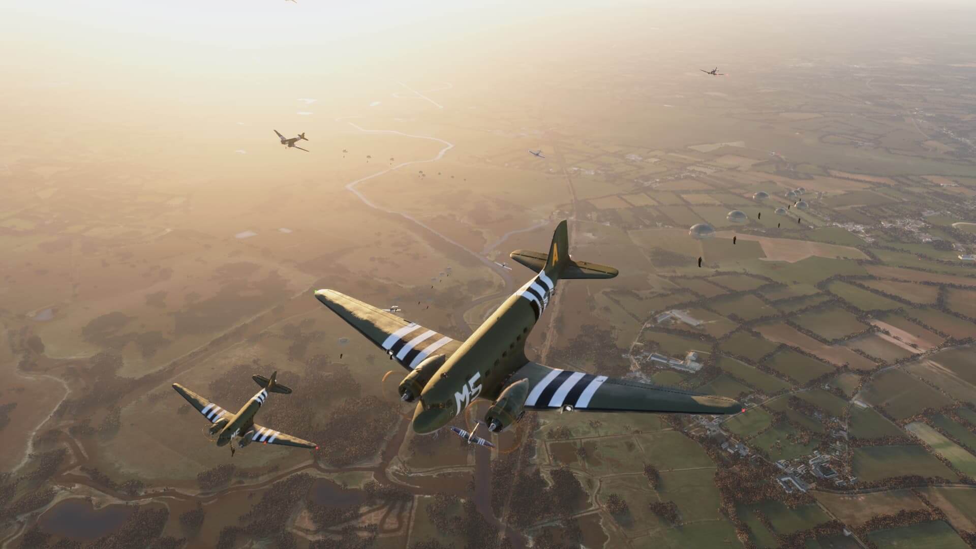 Four C-47D Skytrain aircraft drop paratroopers over Normandy.