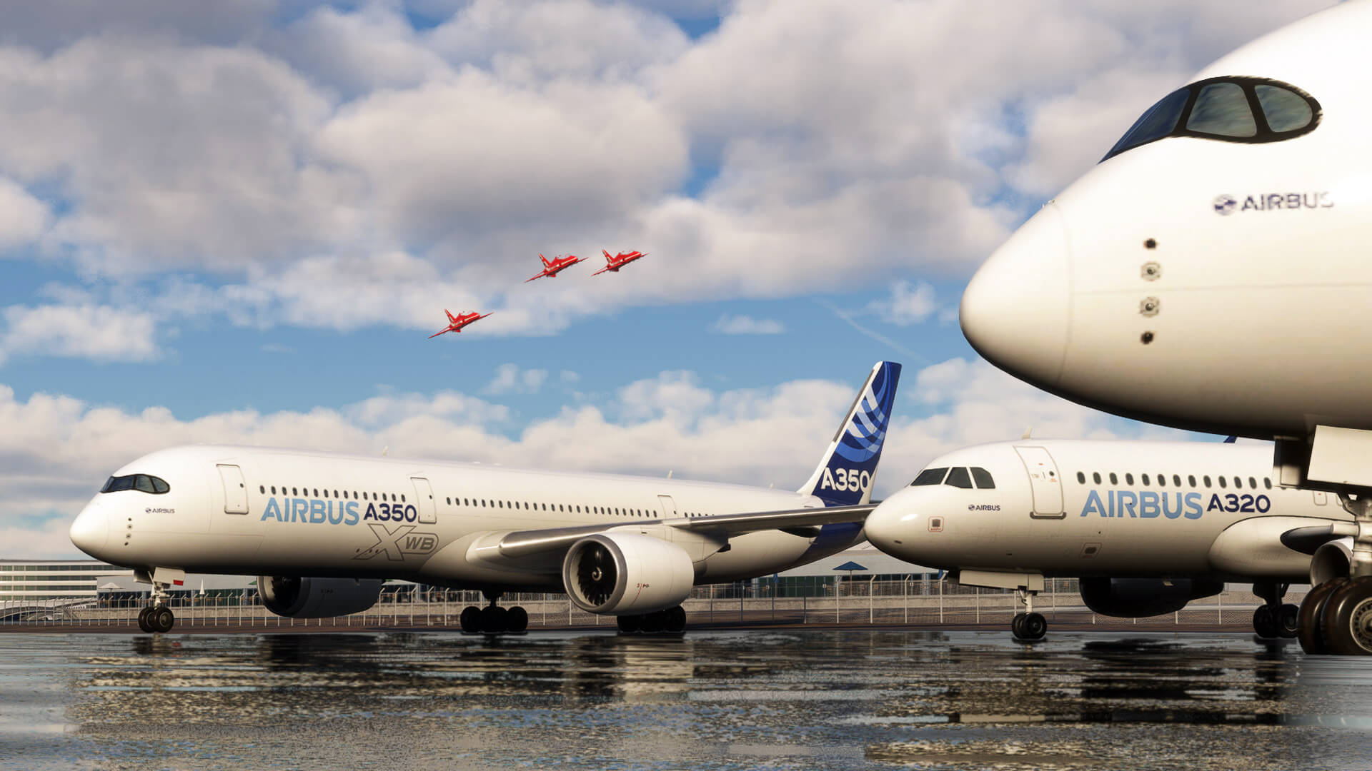 Three Hawks from the Red Arrows fly in formation above Airbus jets parked at Farnborough Airshow