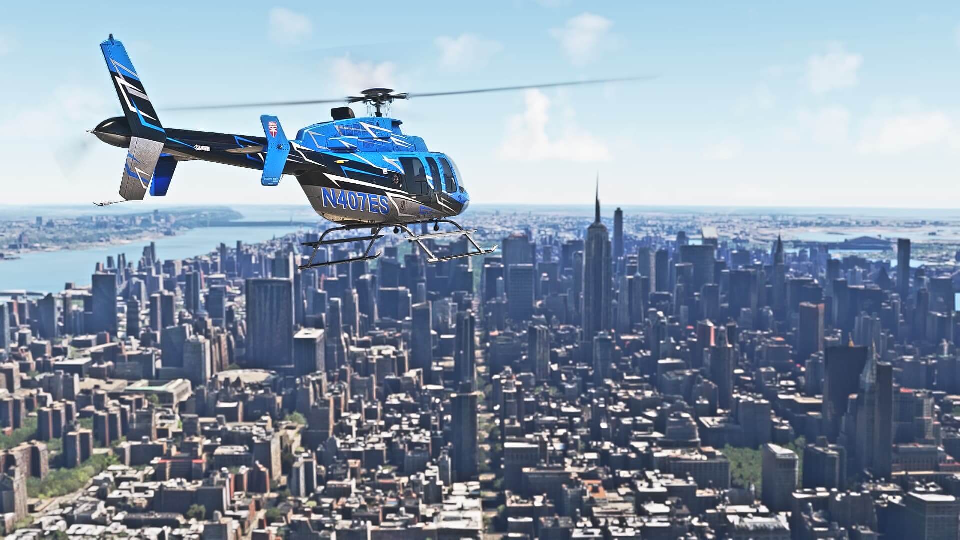 A Bell 407 in blue, black, white, and silver paint scheme heads towards the city of New York