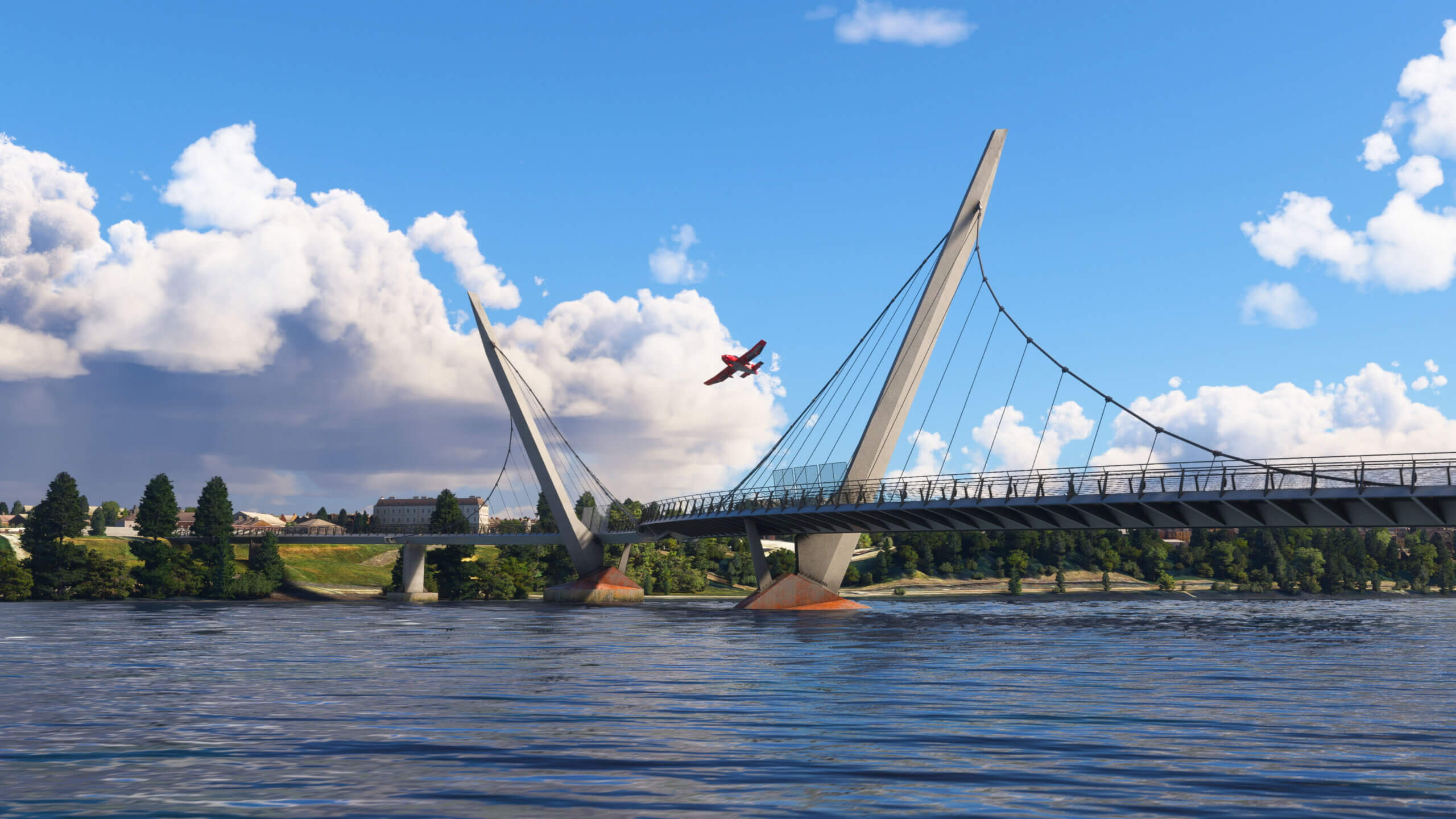 An aircraft flies over the Peace Bridge in Northern Ireland.