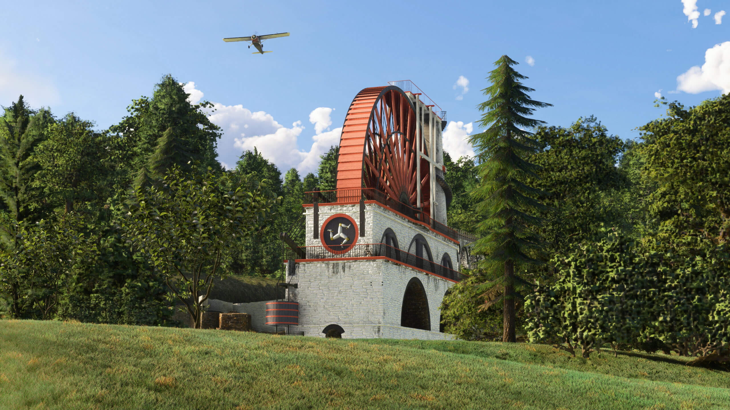 An aircraft flies over the Great Laxey Wheel.