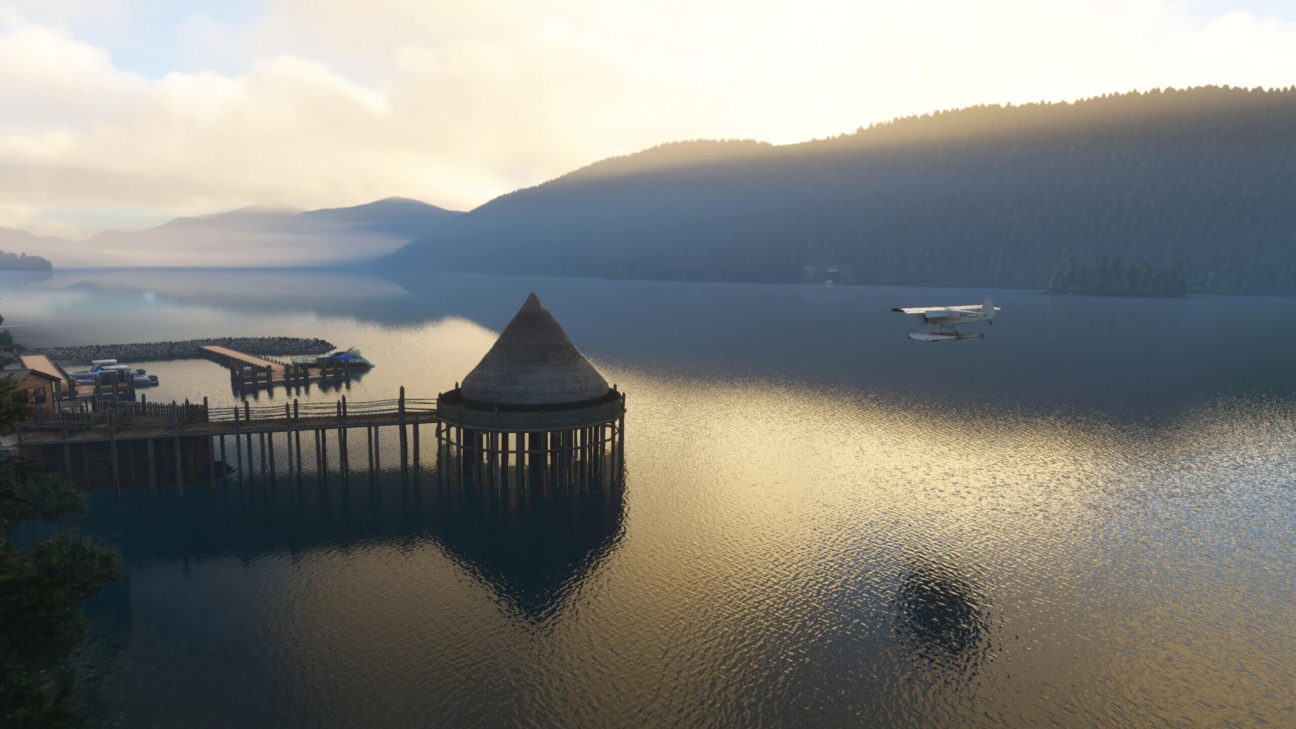 An aircraft flies over Loch Tay towards the Scottish Cranog Centre in Kenmore.