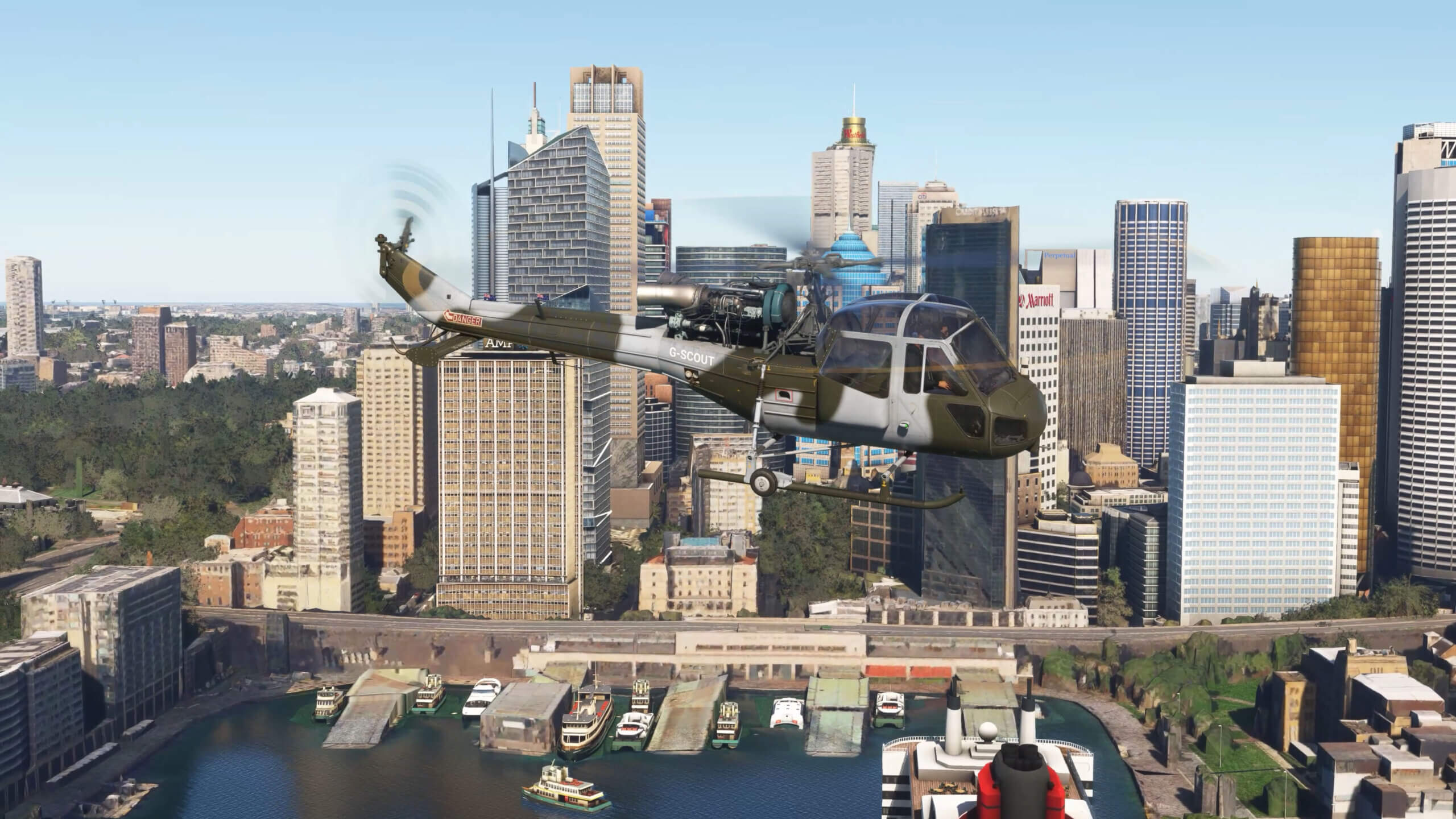 A Westland Scout flies past a high-rise cityscape