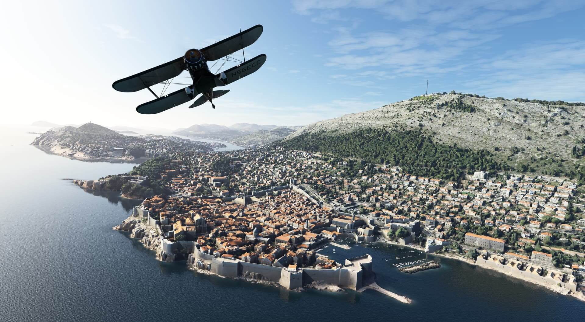 A dual wing propeller aircraft flies over a marina and shoreline city