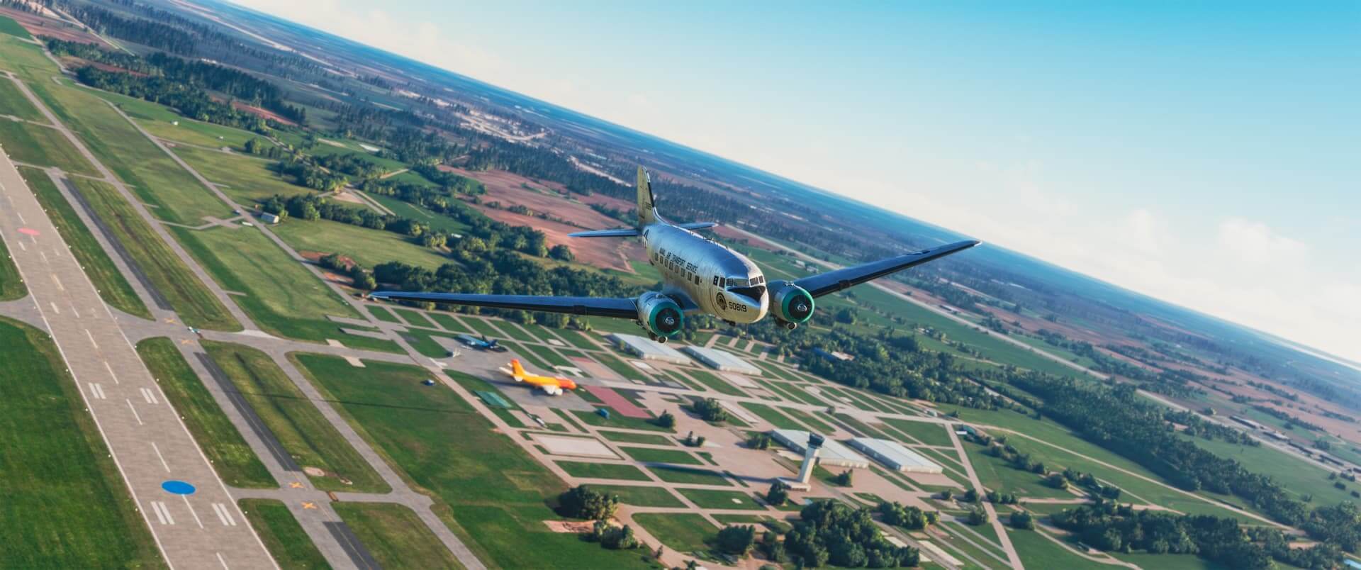 A DC-3 banks right whilst flying over Oshkosh Airshow